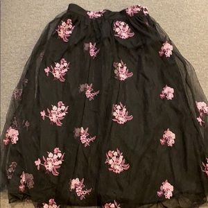 Black skirt with floral embroidery throughout